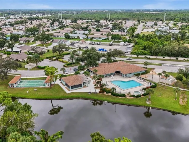 AERIAL VIEW OF THE BACK OF THE CLUBHOUSE, POOL, GAZEBO AND SHUFFLEBOARD COURTS IN PARK FOREST.