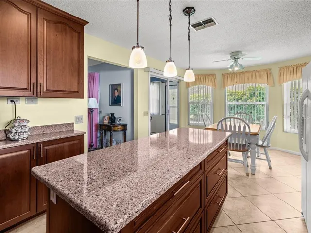 VIEW FROM THE KITCHEN TOWARDS THE DINING AREA AND LIVING ROOM.