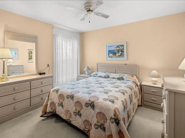 BEDROOM #2. FULL SIZE BED WITH 2 DRESSERS, MIRROR AND 2 BEDSIDE  TABLES WILL CONVEY WITH THE HOME.