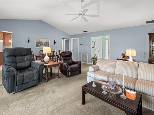 VIEW OF THE LIVING ROOM TOWARDS THE KITCHEN AND 2ND BEDROOM.