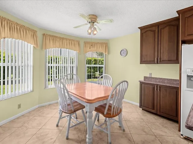 THE DINING AREA IS BRIGHT AND OFFERS ADDITIONAL CABINTERY.