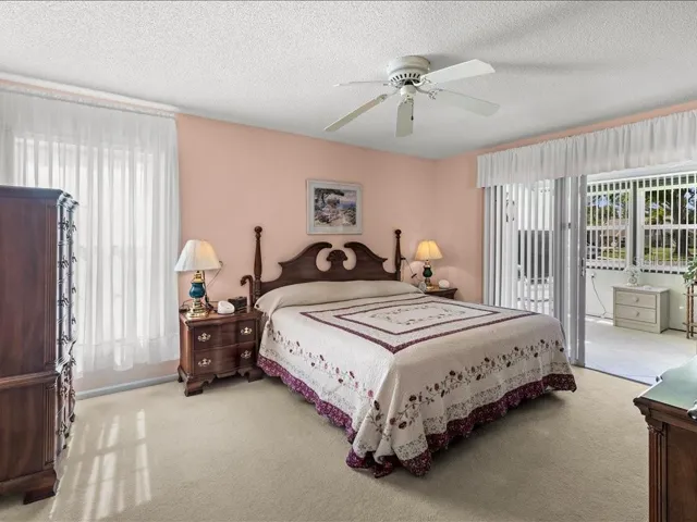 THE PRIMARY BEDROOM HAS ACCESS TO THE FLORIDA ROOM.