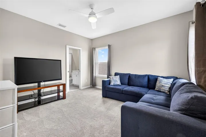 Office off of the loft serves as a second living suite with entryway to a full bathroom and bedroom.