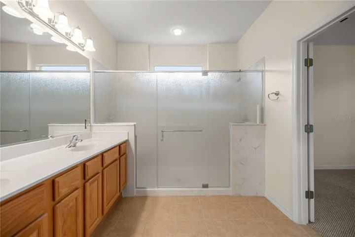 Large Primary Bathroom with Dual Sinks and Large Walk in Shower.