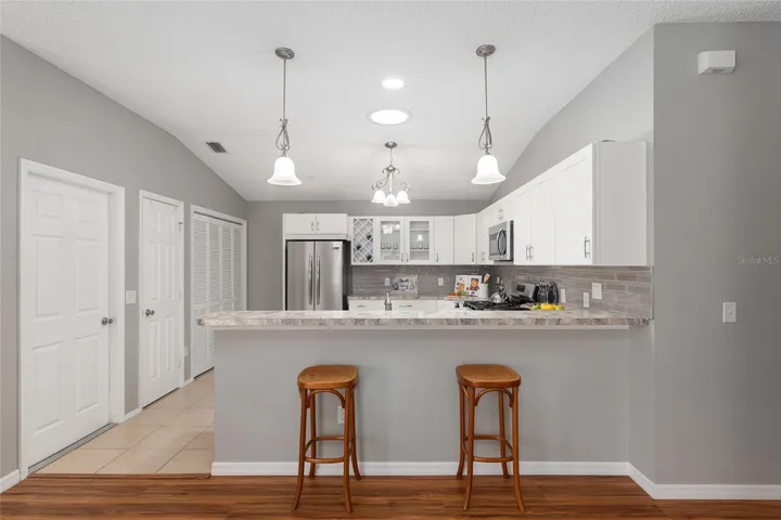 View from Living Room to the remodeled Kitchen.  More Cabinets, More Counter Space and a Solar Tube!