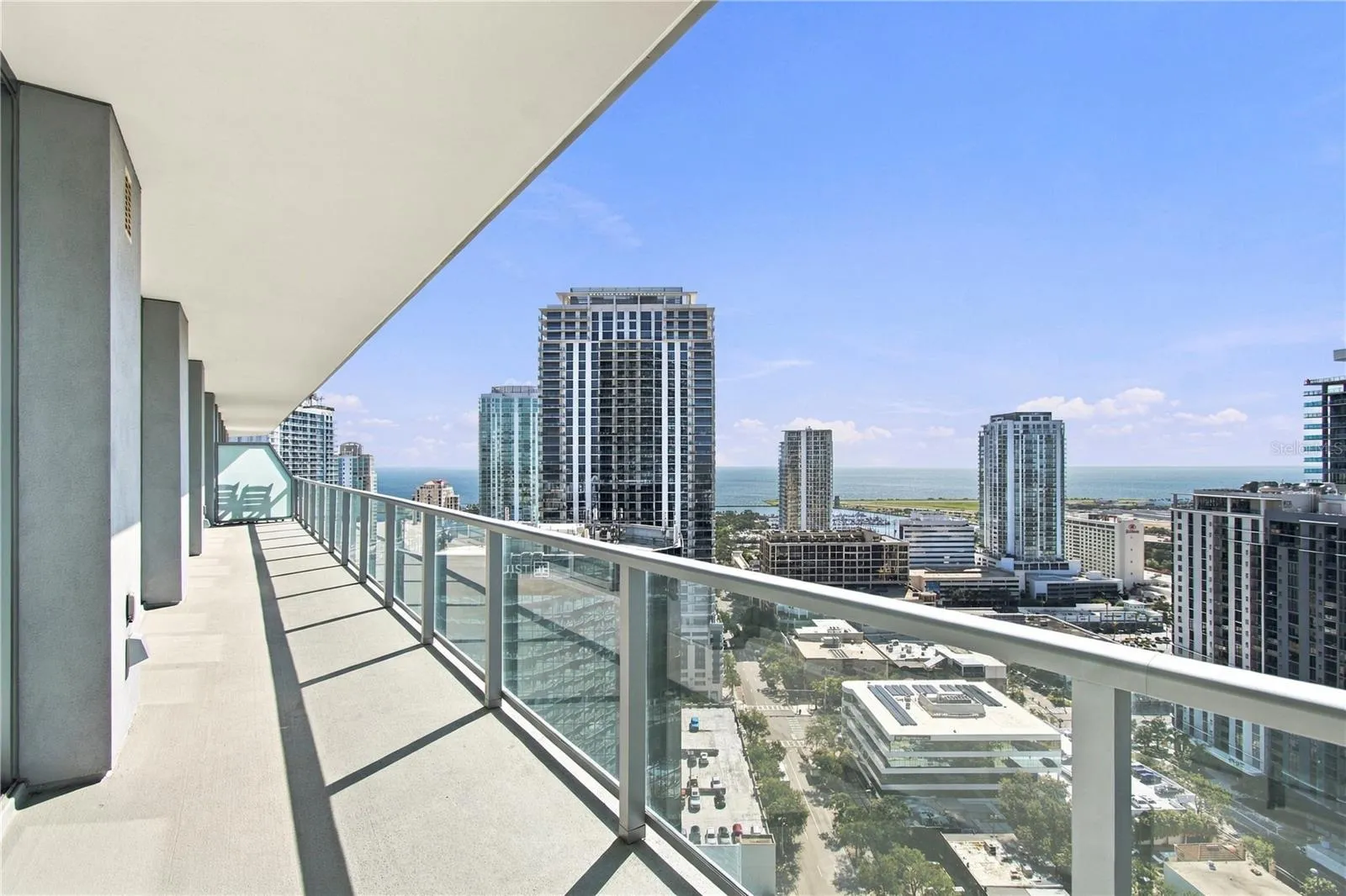 60 ft balcony runs the full length of condo with views of both city and bay
