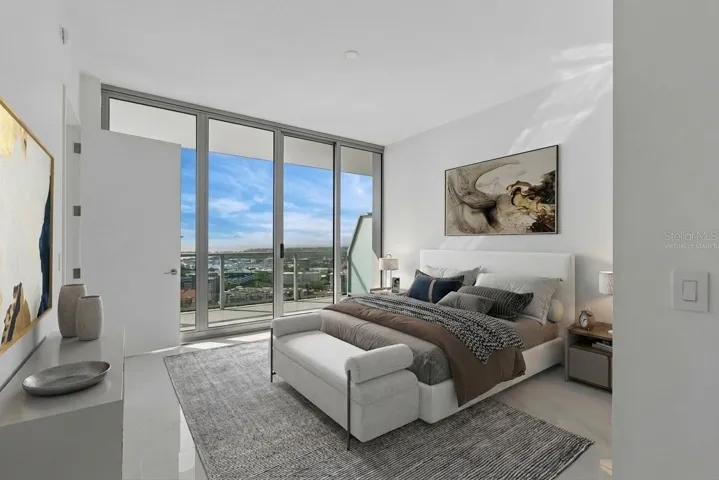 Guest suite also has floor to ceiling sliders opening directly to balcony virtually staged