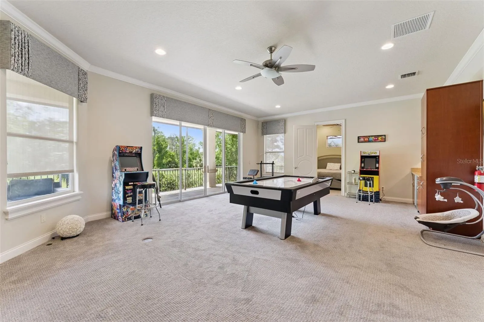 Upstairs bonus room or work out room with balcony