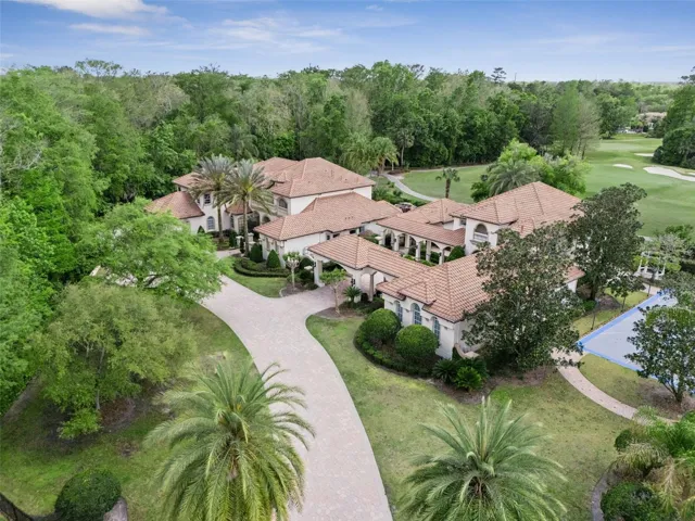 Welcome to your private compound with no neighbors on three sides, sited on 1.55 acres, gorgeous golf views of the 8th hole, separate 3100 sqft  guest house, sports court with LED lights, beautiful pool/spa/cabana, putting green, koi pond, 6 car garage with an add'l golf cart bay and fully fenced around the entire property!