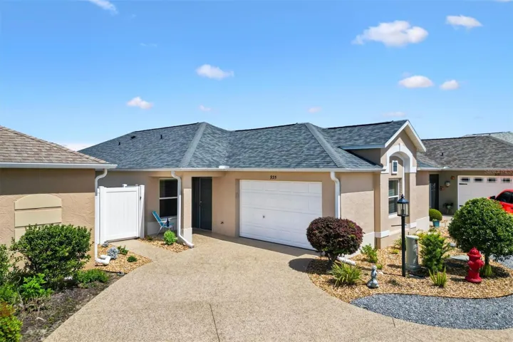 A meticulously maintained Courtyard Villa showcasing a new roof, fresh interior and exterior paint, and a wealth of recent updates.