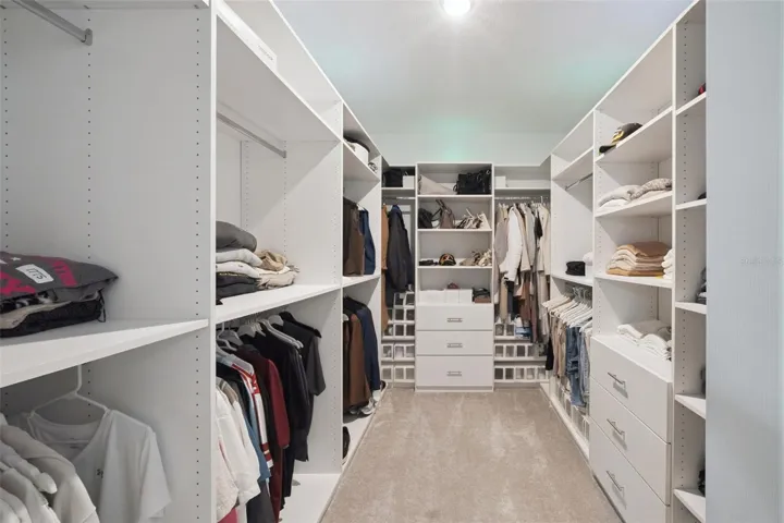 Large master closet! Custom shelves and lighting (changes colors)