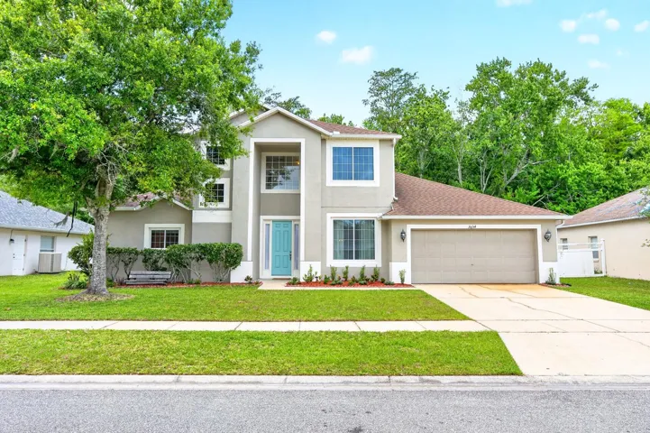 Welcome to this beautifully maintained 2-story home in the GUARD-GATED community of Springlake Village in Kissimmee, where comfort, space, and a SERENE NATURAL SETTING come together across more than 2,300 SQUARE FEET of thoughtfully designed living space.