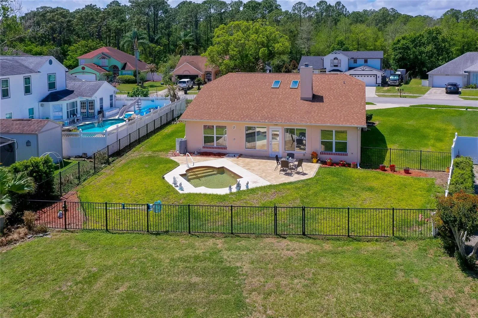 Fenced backyard with pool