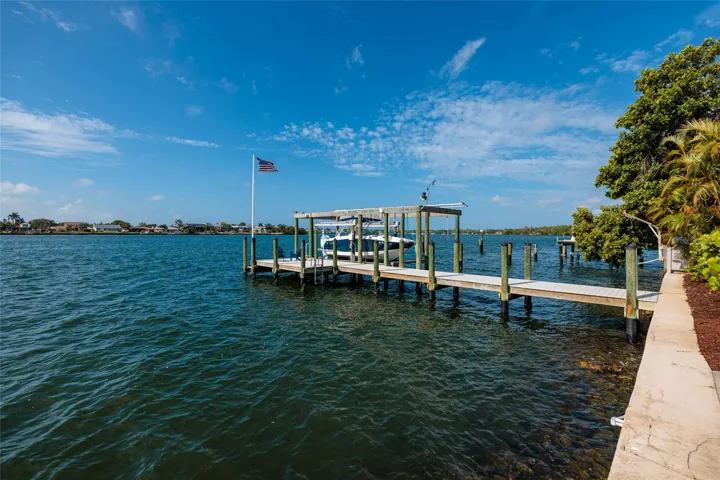 Double lot provides open water and neighborhood views (nice to see lights at night across the Bay)!