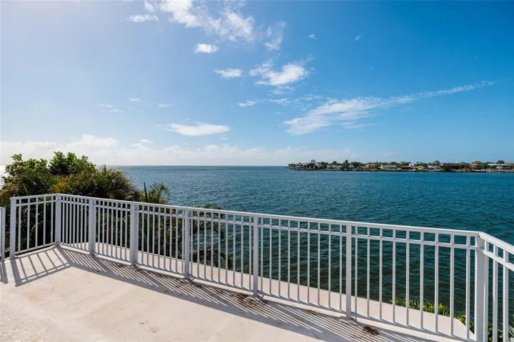 Expansive rooftop observation deck with panoramic water vistas