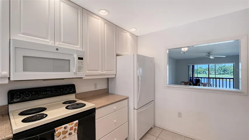 Kitchen with pass thru to Dining area