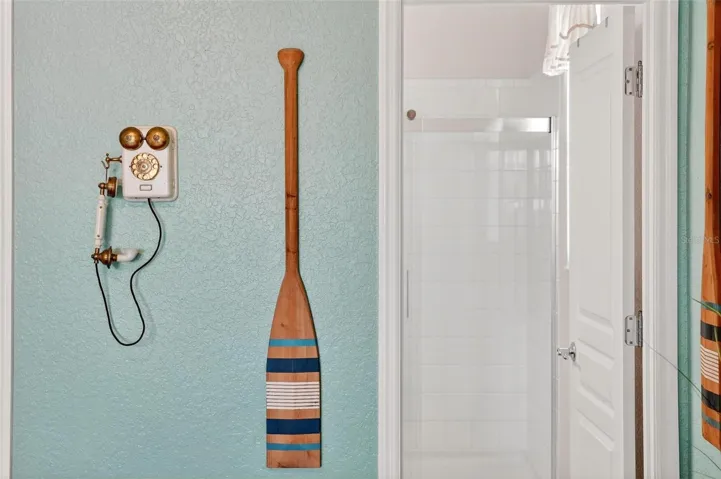 Primary_bathroom_door_with_updated_shower_enclosure