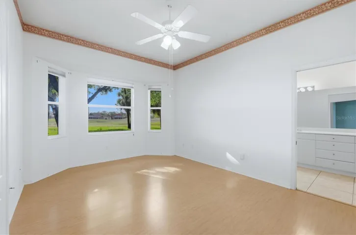 Main bedroom with bay  windows overlooking golf course view