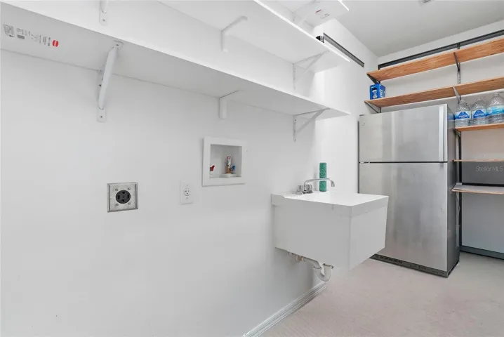 Laundry room located in the garage.