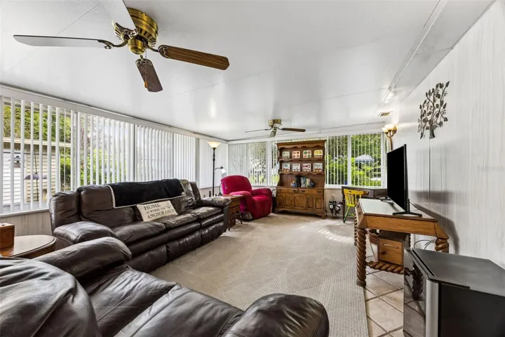 The living room overlooks  the tranquil back yard