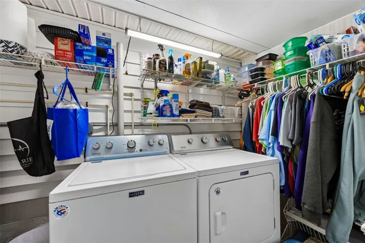 While housing the washer & dryer behind closed doors