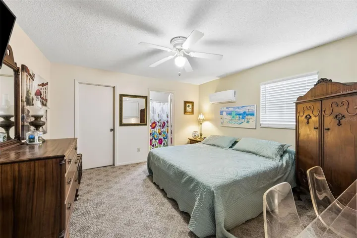 The second bedroom is tucked away beside the garage