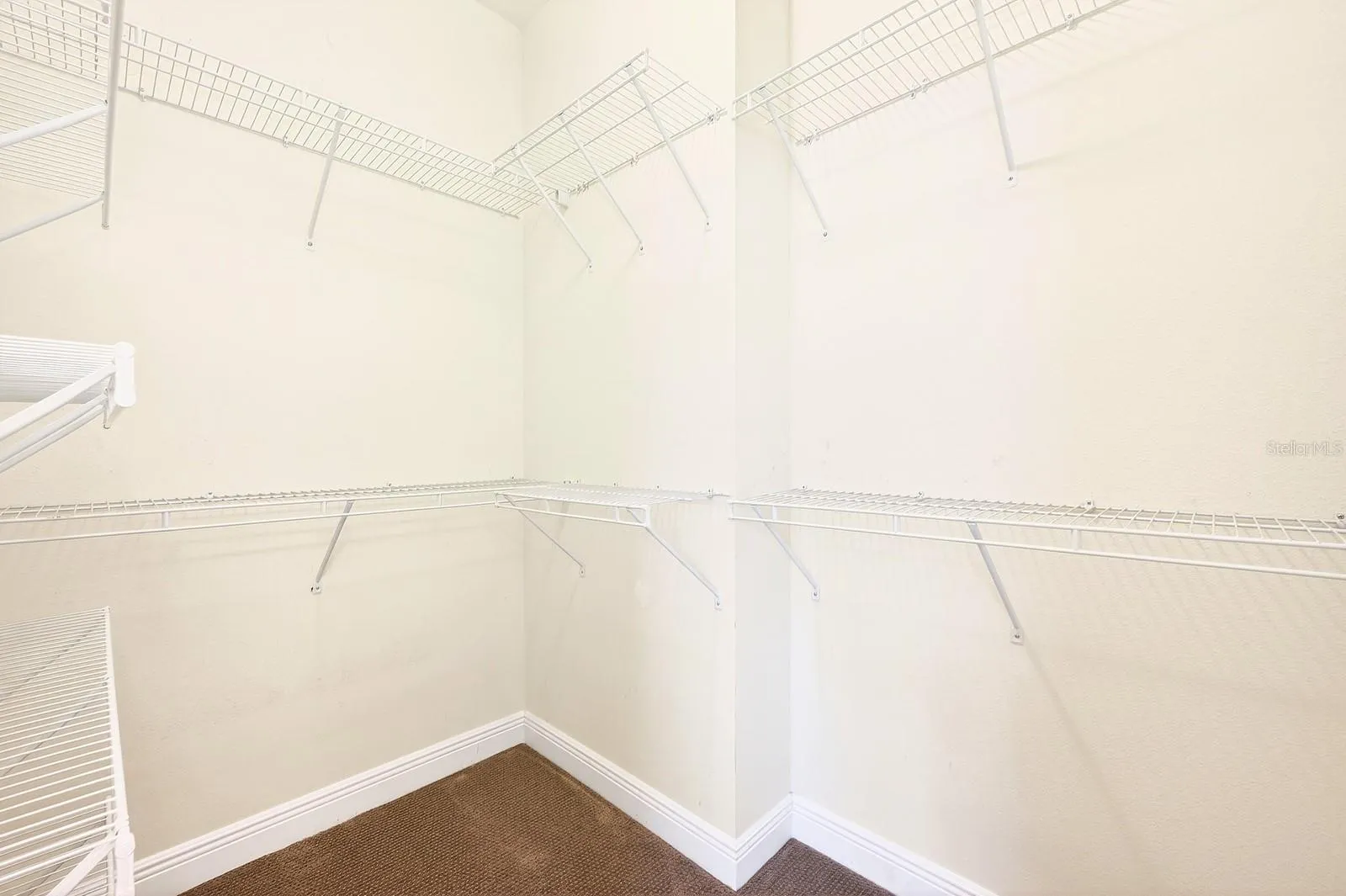 Primary suite walk-in closet.
