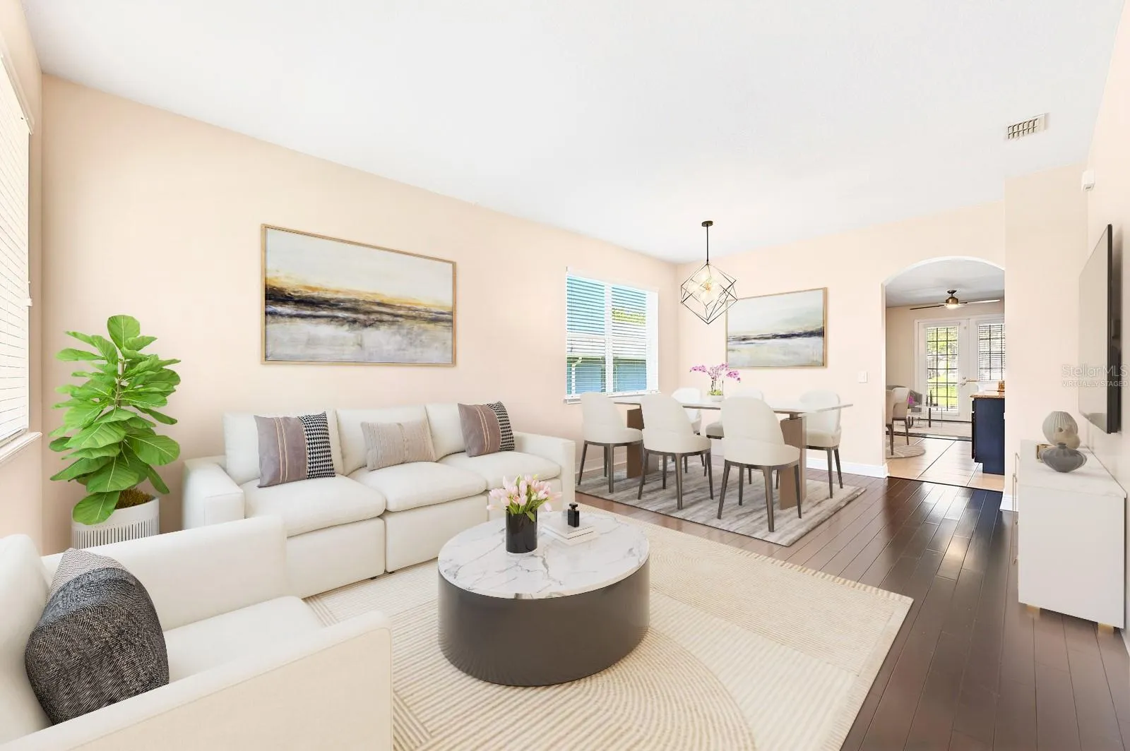 The foyer opens up to flexible formal living and dining spaces. Virtually Staged.