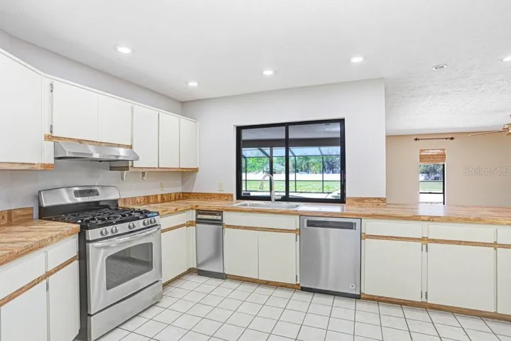 Open kitchen with stainless steel appliances