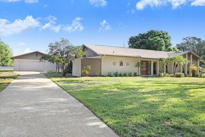 Left Side of home showing the detached garage