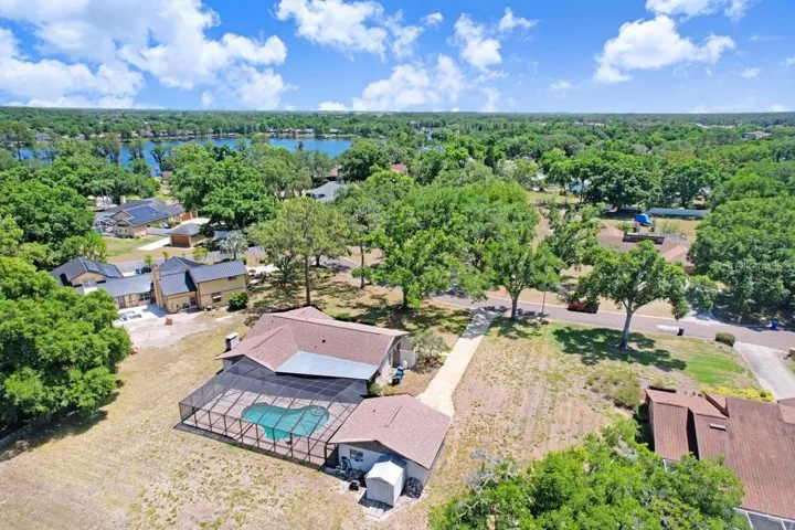 Ariel View of the one acre lot with with detached garage and pool