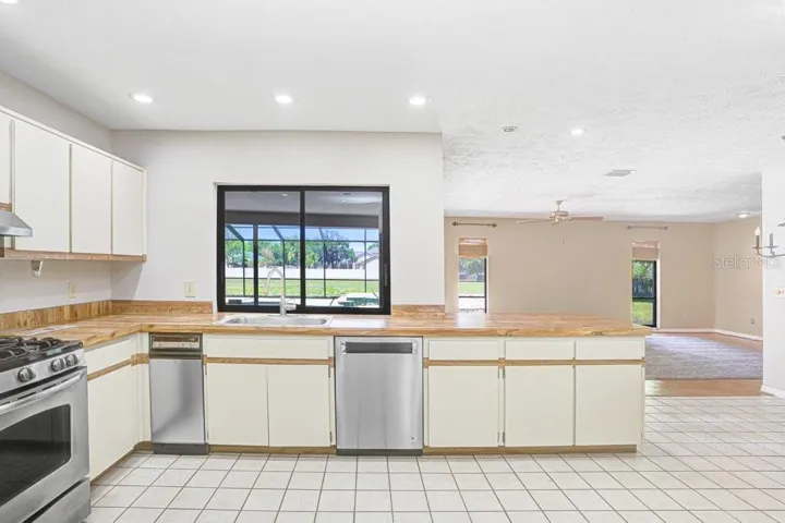 Open kitchen with stainless steel appliances