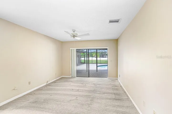 Primary Bedroom with sliders to outside lanai