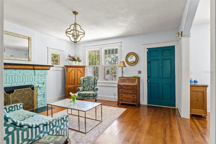 Large Living Room with Brick Painted Fireplace