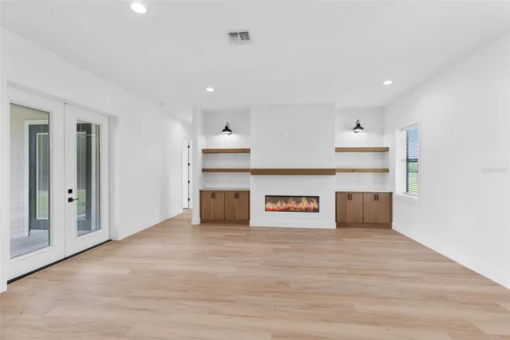 Living room with built ins and electric fireplace