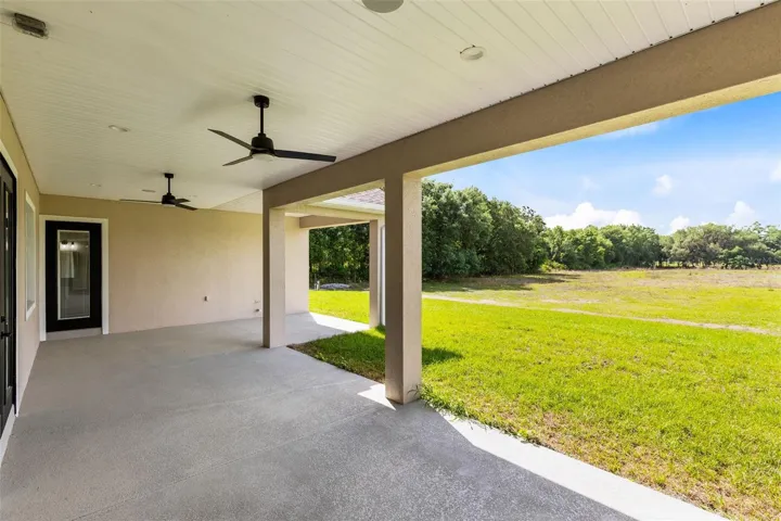 Back porch with access to primary suite