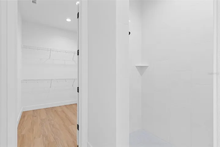 Primary walk-in closet and shower