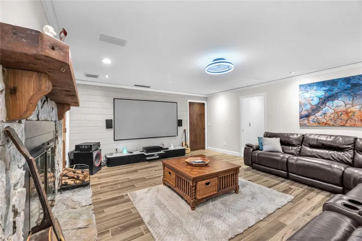 A separate family room/ TV room creates the perfect setting for cozy nights in streaming your favorite series complete with surround sound for an immersive experience (TV does not convey)