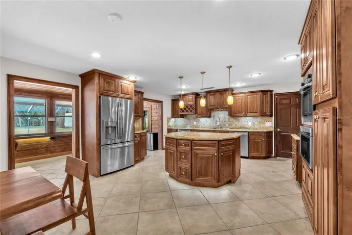 Stunning custom-built island anchors the space.