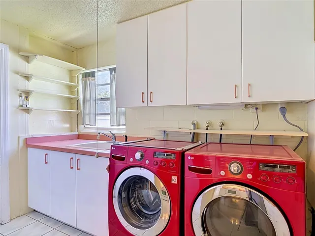 indoor laundry room with mop sink and pantry