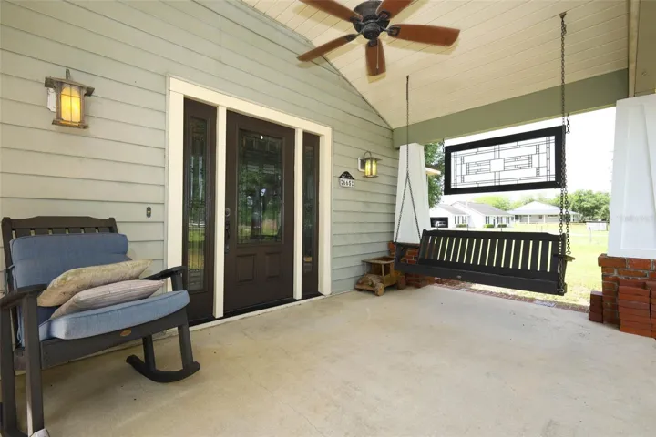 Lovely porch to sip a drink, visit friends, and enjoy the breezes from Lake Mills!