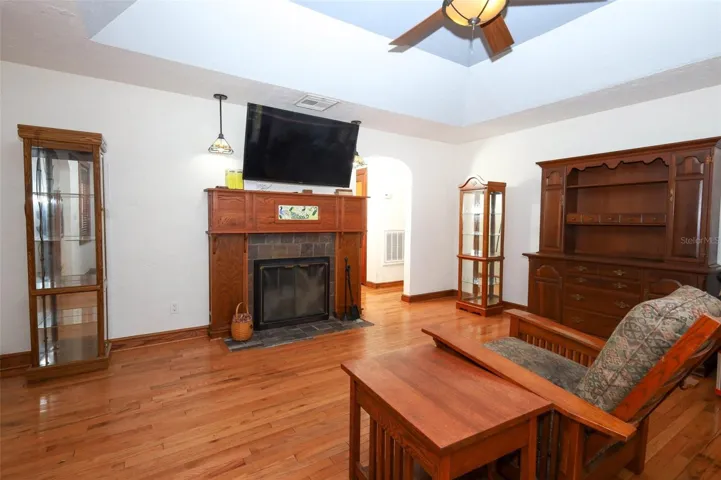 Charming living room with easy access to bedrooms and a beautiful fireplace