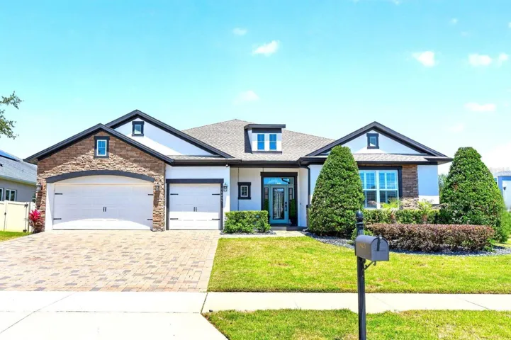 OWNED SOLAR, a CUSTOM BACKYARD OASIS, and a long list of thoughtful UPGRADES come together in this beautifully enhanced home in the highly sought-after Johns Lake Landing community of Clermont!