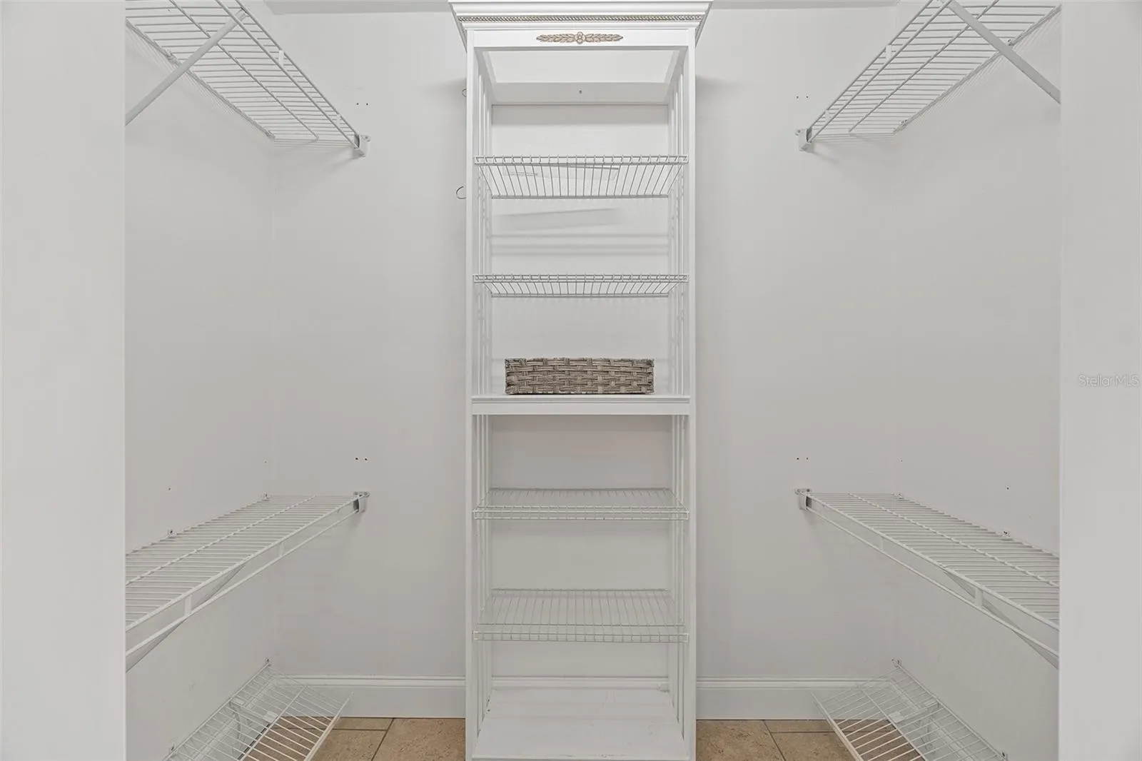 Primary bedroom walk in closet