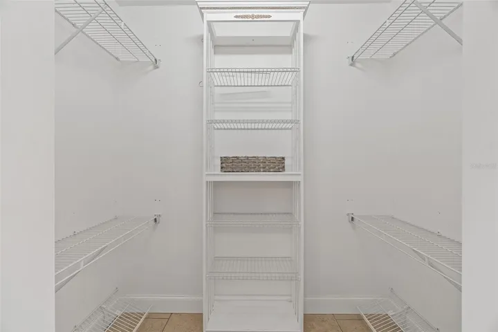 Primary bedroom walk in closet