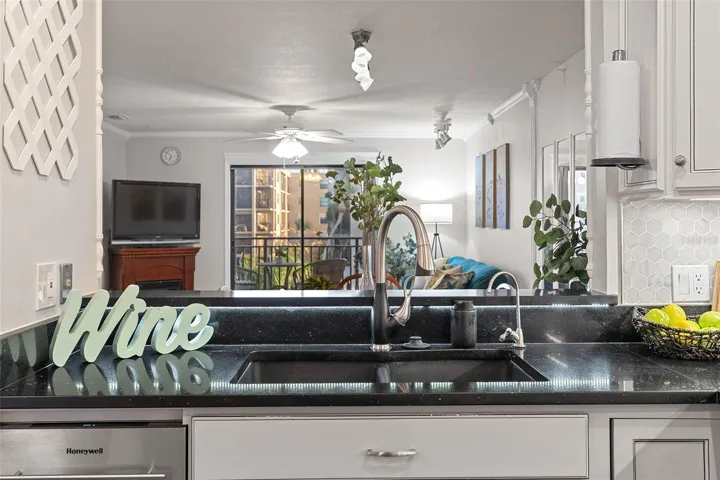 Kitchen sink overlooks living area