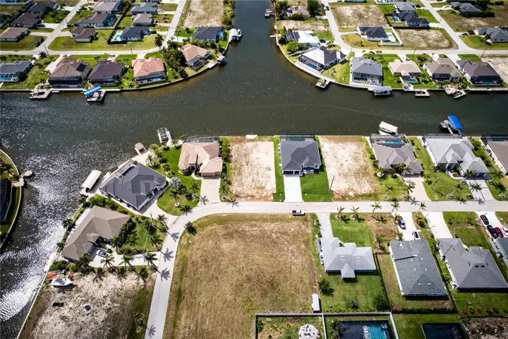 Plenty of space to build your CUSTOM HOME with DOCK, BOAT LIFT, TIKI-HUT, CAPTAIN WALK, and other WATERFRONT LIFESTYLE FEATURES, PERFECT FOR ENJOYING FISHING FROM YOUR BACKYARD or LAUNCHING YOUR NEXT COASTAL ADVENTURE!