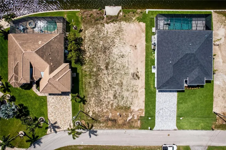 This DIRECT GULF ACCESS lot offers 80 ft x 125 ft (10,000+ sq ft) and features a NEWER SEAWALL (2024), a major value add saving time and significant construction costs!