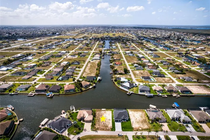 ENJOY WIDE WATER VIEWS and EXCEPTIONAL NATURAL LIGHT from this PREMIUM HOMESITE surrounded by newer construction residences.