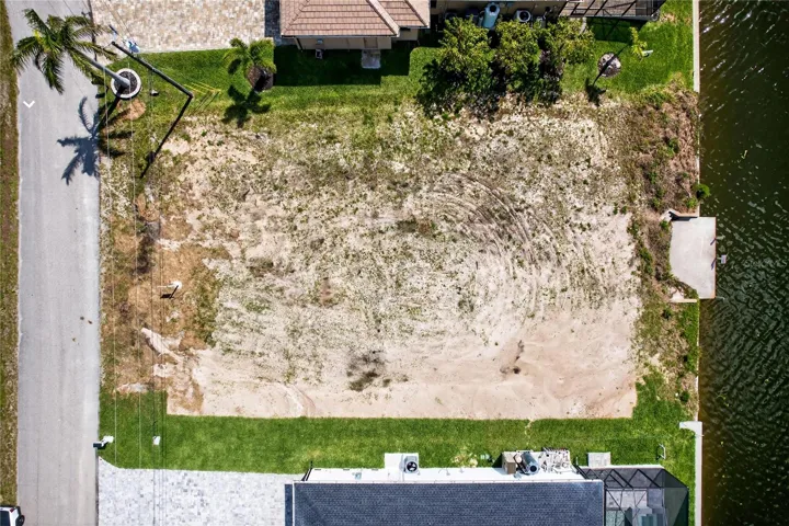This DIRECT GULF ACCESS lot offers 80 ft x 125 ft (10,000+ sq ft) and features a NEWER SEAWALL (2024), a major value add saving time and significant construction costs!